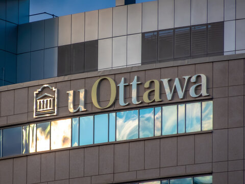 Ottawa, Ontario, Canada. Sep 9, 2026. Low angle close-up of uOttawa logo sign mounted on modern University of Ottawa campus building facade.