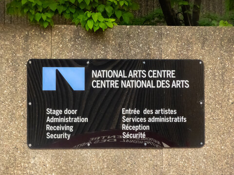 Ottawa, Ontario, Canada. Sep 9, 2026. Sign for National Arts Centre stage door, administration, and security mounted on concrete wall.