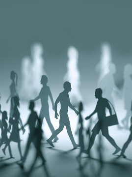 Close Up of Miniature Paper People Figures Walking in Different Directions