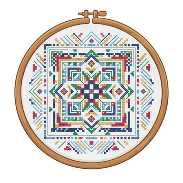 Colorful cross stitch sampler in wooden embroidery hoop with geometric patterns and symmetrical design on white fabric