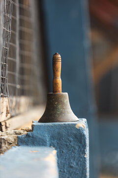 A bell with a wooden handle