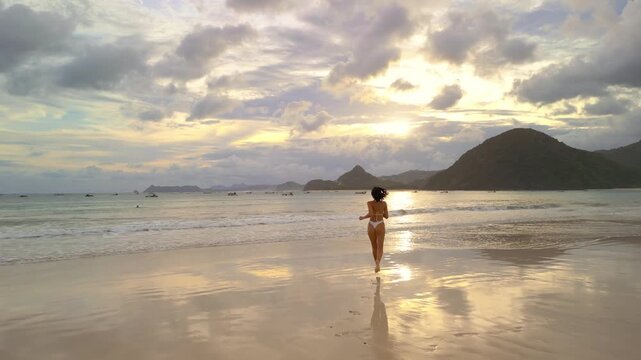Selong Belanak Beach Sunset: Woman Walking on Shore
