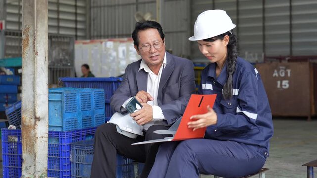 Industrial Worker Supervisor Document Review, Manufacturing Facility Workplace Inspection, Teamwork Discussion Planning, Factory Warehouse Equipment Safety Conversation, Clipboard Logistics