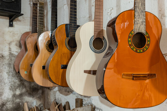 Traditional luthier workshop with acoustic guitar craft production and woodworking tools