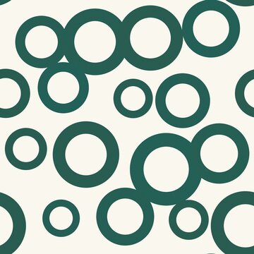 A seamless pattern of overlapping circular shapes in shades of green and white.