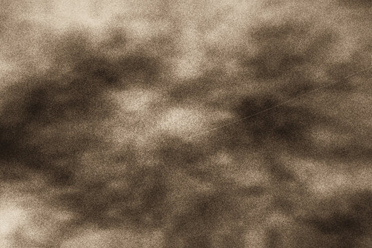 Sepia toned grainy smoke texture creating vintage aesthetic for artistic graphic projects features subtle film scratches for authentic old paper appeal.