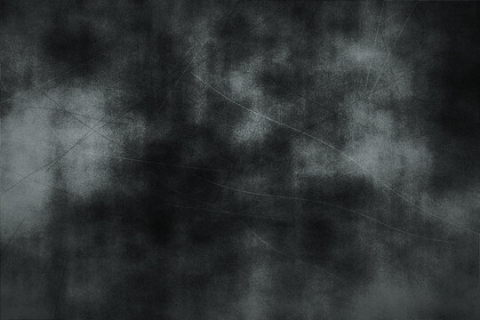 Abstract dark grunge texture background in shades of gray with subtle scratches and smoky patterns suitable for graphic design.