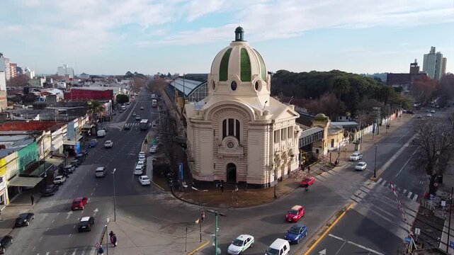 Panoramic drone perspective of La Plata Train Station featuring its iconic dome and platform roof structures in Argentina.