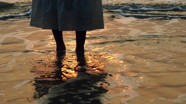 Human feet on the surface of the sea bokeh style background