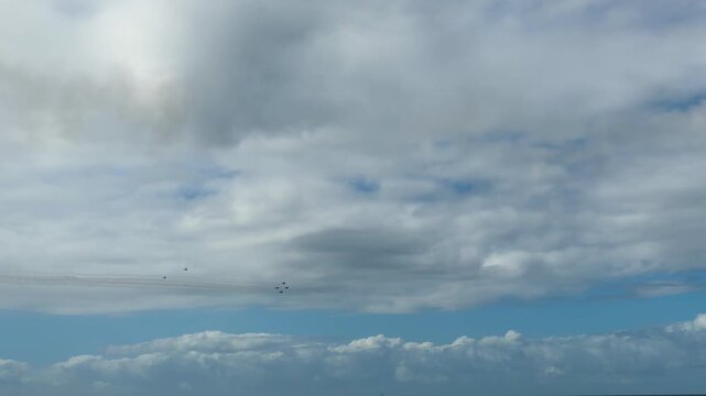 Vintage Spitfire Warbird Silhouette Flying Through Overcast Sky at Gold Coast