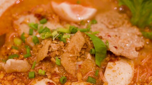 Spicy Tom Yum Noodle Soup with Fish Balls and Boiled Egg
