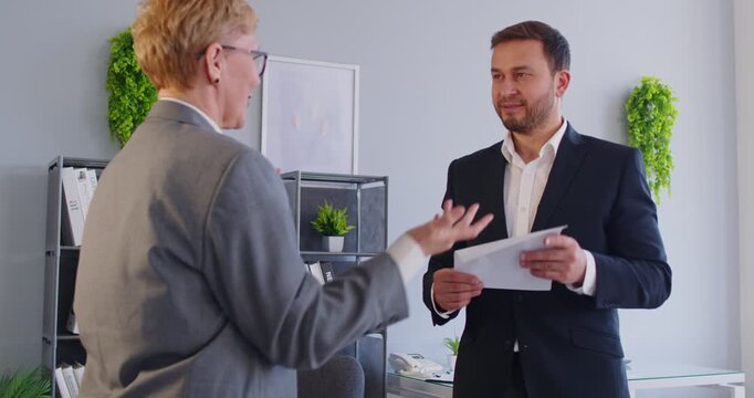 Business people shake hands during office meeting, sealing agreement or successful deal with partnership, focusing on teamwork and cooperation in a professional setting with collaboration.