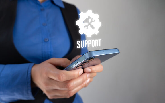 Support icon hovers above smartphone held by person