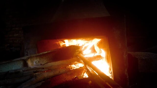 glowing flames burning brightly inside a vintage wood-burning stove
