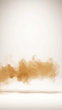 Amber smoke swirls elegantly across white background in smooth cinematic motion for artistic digital visual effects and creative background footage