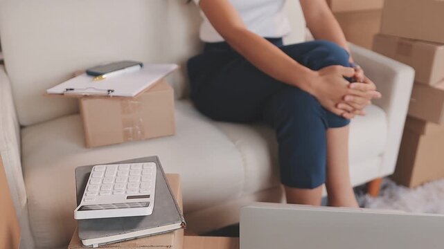 Portrait of Starting small businesses SME owners, two Asian woman check online orders Selling products working with boxs freelance work at home office, sme business online small medium enterprise