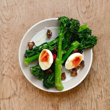 Steamed broccolini garnished with soft boiled eggs and savory bacon bits boiled egg green vegetables tasty meal