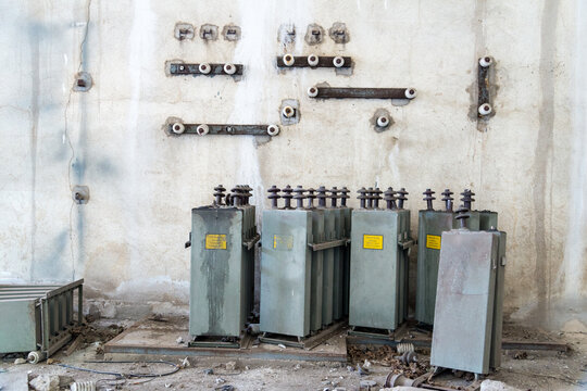 Italy, Sardinia, Porto Torres.  Old electrical transformers inside abandoned factory.