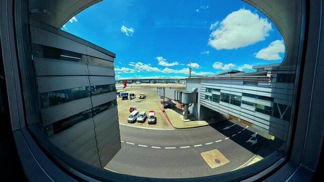 Airport tarmac activity and sky view from bogota terminal window