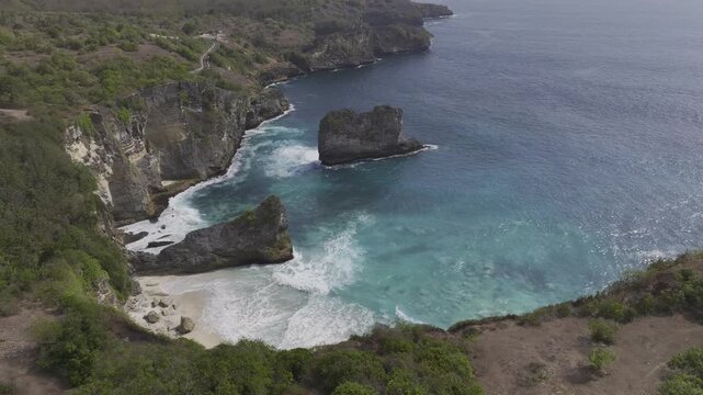 Aerial view of the cliffside coastline and beaches of Penida Island, Indonesia