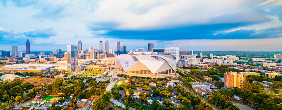 Panoramic aerial view of Mercedes-Benz Stadium, downtown Atlanta, and the surrounding metropolitan landscape.