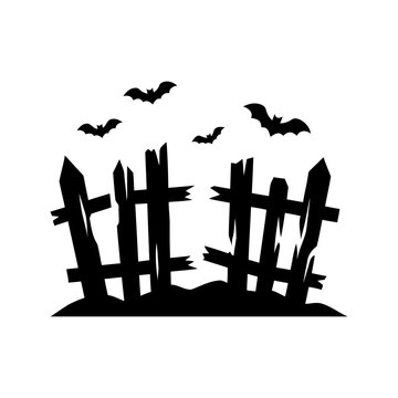 Spooky Halloween scene silhouetted fence on dark ground with flying bats suitable for holiday decorations party invitations and spooky designs.