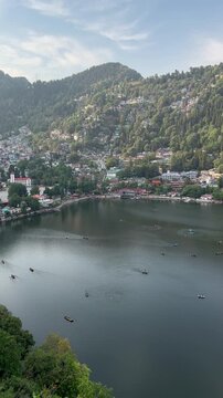 Vertical Shot of Rowboats Sailing on Nainital Lake During Late Afternoon Golden Hour, Uttarakhand, India