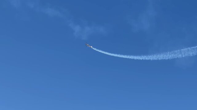 Stunt Plane Performing Aerobatics with Smoke Trail over Gold Coast