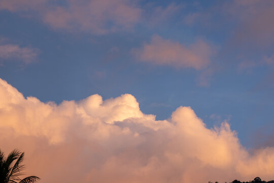 Golden Hour Clouds Against Blue Sky