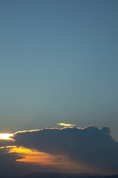 Golden Sunset Sky With Dark Clouds