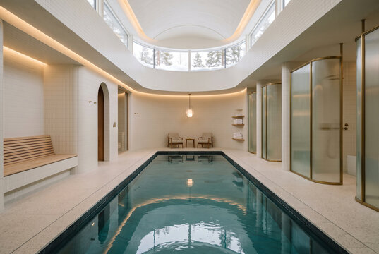 Luxury Indoor Lap Pool Hall with Curved Walls and Turquoise Water