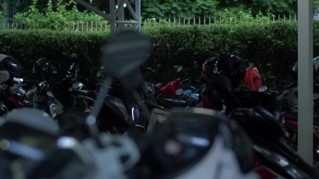 Crowded Covered Motorcycle Parking Lot Under Steel Truss Roof