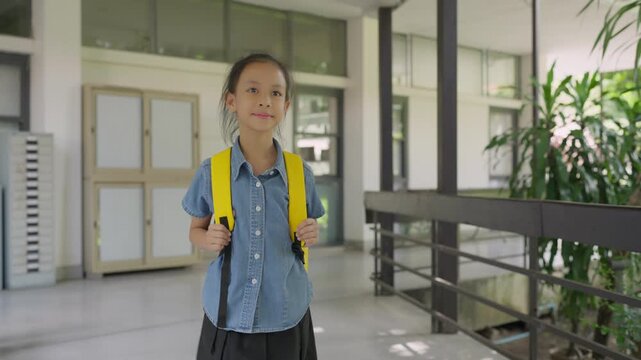 Asian girl student walking to school in the morning