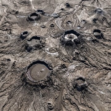 Aerial Mud Volcano Craters with Liquid Mud Pools and Cracked Earth