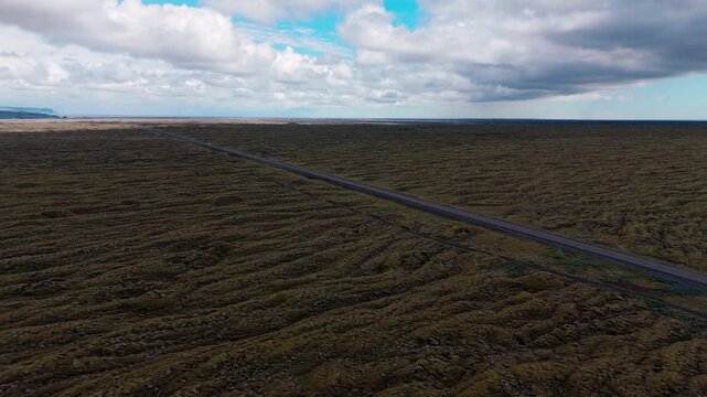 Volcanic panorama of dark and vast Eldhraun lava field, Iceland, aerial drone shot