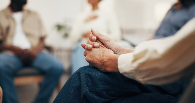 Hands, support group and person with anxiety in therapy, ptsd or trauma counseling in office. Nervous, psychology or woman with depression, mental health challenge or stress in meeting with community