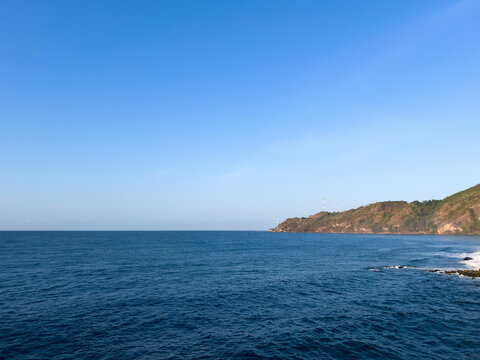 Scenic Coastal View of Ocean and Mountain