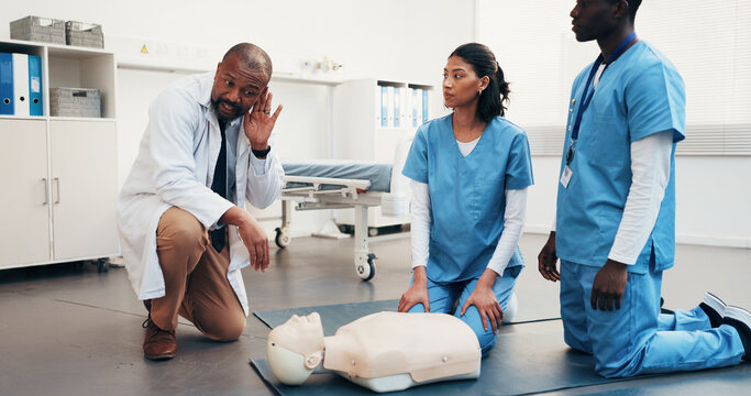 Dummy, team and doctor demonstration for cpr training, identify agonal gasping or safety protocol. Man, physician or nurses with mannequin, teach technique or listen to reflex sign for cardiac arrest