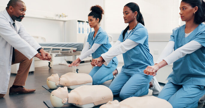 Health, team and mannequin in training for cpr, compression technique and residency practical. Man, physician and resident doctors with dummy, first aid demonstration or simulation for cardiac arrest