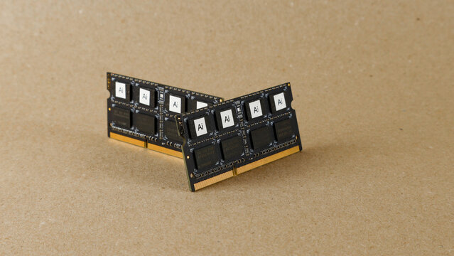 AI computer memory chips sit on a brown background, representing data processing, machine learning, and technological advancements in modern computing systems