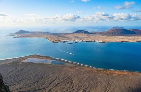 View from steep cliffs to sea and the island of La Graciosa, Mirador del Rio viewpoint, Lanzarote, Canary Islands, Spain