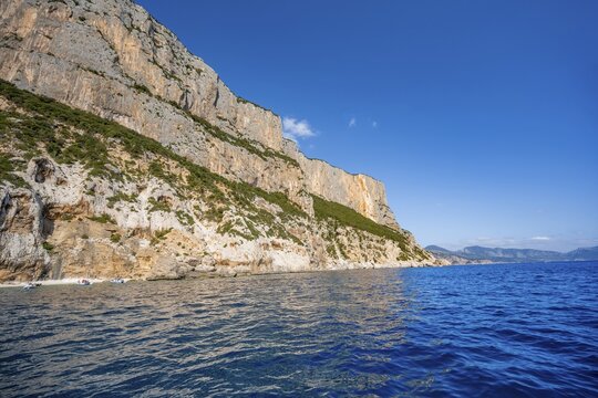 Picturesque rocky coast, cliffs and blue sea, Golfo di Orosei, Baunei, Sardinia, Italy