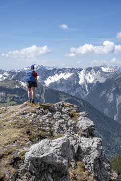Hiker on hiking trail to Thaneller, Lechtal Alps, Tyrol, Austria