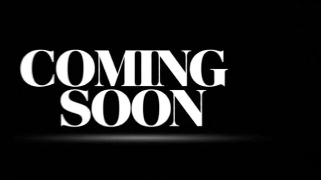 Coming soon announcement text is displayed in bold white serif typography against a stark black background.