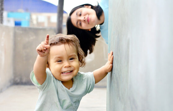Siblings playing happily. Blur expressing the motion moment.