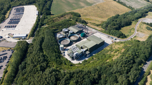 Aerial view of biowaste treatment facility near farmland