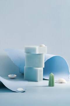 Sea-inspired handmade soap bars in minimalist blue still life
