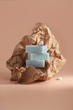 Handmade herbal soap bar with craft paper still life