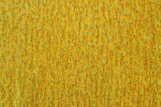 Golden weathered stone texture background with natural patina