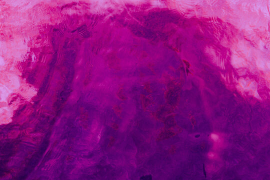 Vibrant magenta purple abstract water texture background